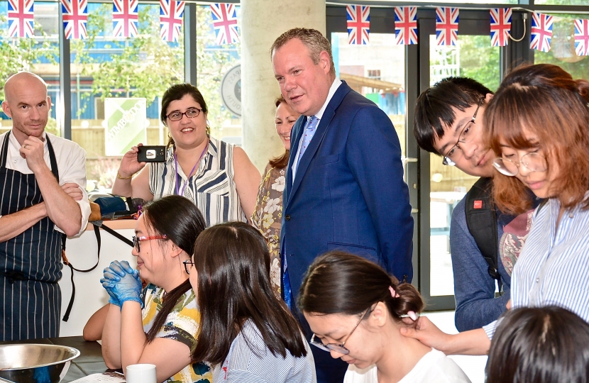 Conor chats to students at Kaplan International College.