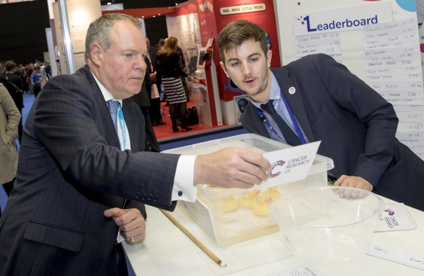 Conor speaking with members of Cancer Research UK.