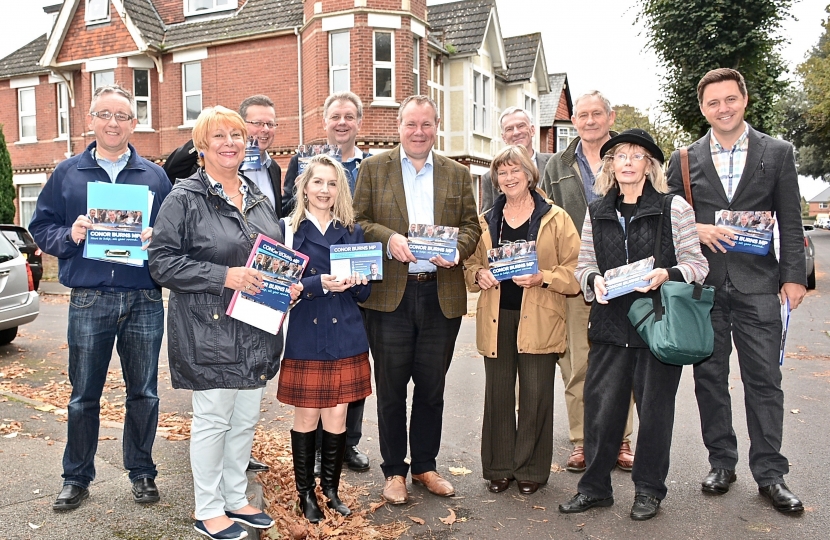 Conor and a group of residents preparing to deliver surveys.