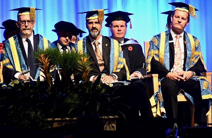 Conor pictured with the platform party as the graduation begins. 