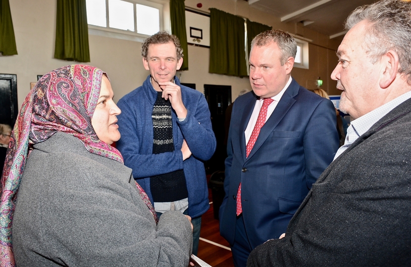 Conor pictured talking to a resident of West Howe. 