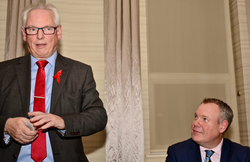 Conor pictured listening to Lord Maude address the room. 