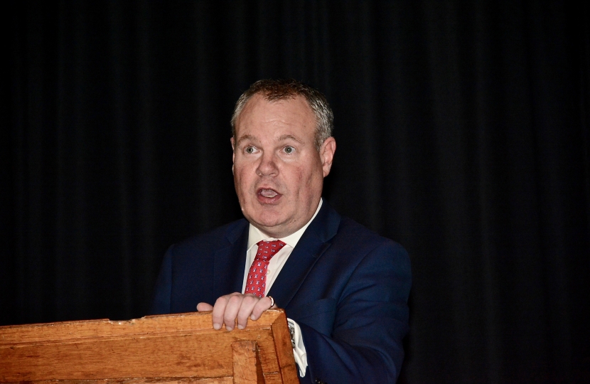 Conor pictured giving a speech to the students of Bournemouth School.