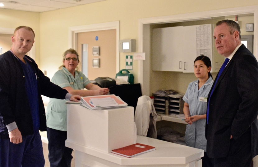 Conor pictured talking to medical staff at Nuffield Health.