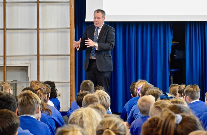 Conor pictured talking to Key Stage 2 students in assembly about the role of an MP. 