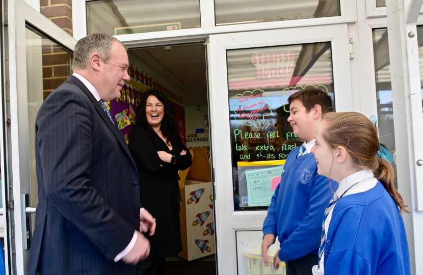 Conor pictured with Head teacher Kate Curtis talking to students whilst being shown round the school. 