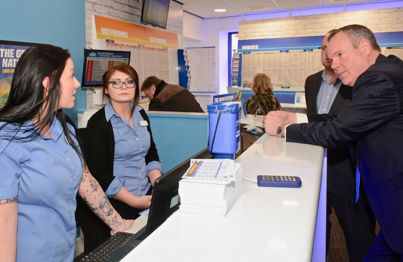 Conor pictured talking to Coral Bet shop staff about the Grand National. 