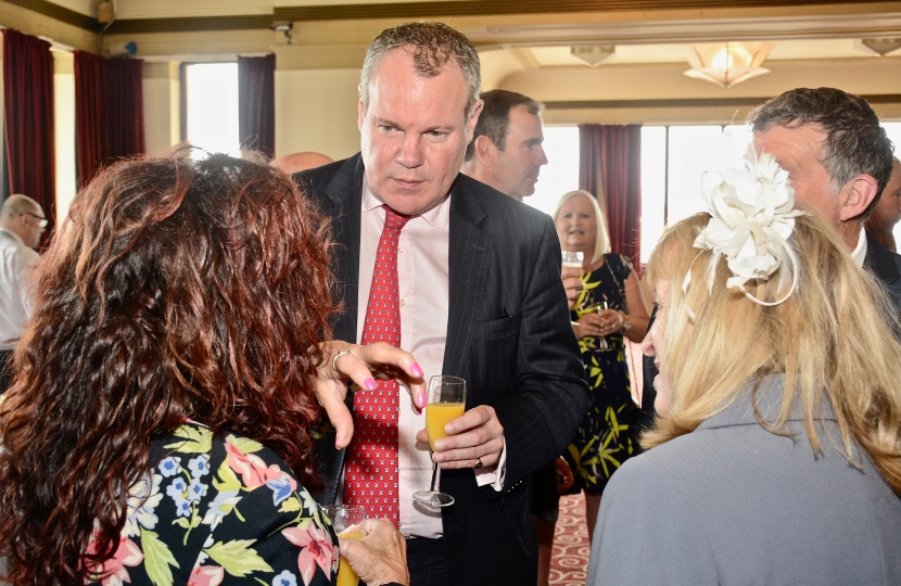 Conor pictured discussing local events with attendees of the ceremony. 