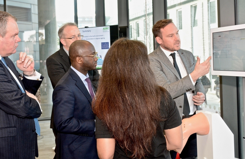 Conor pictured listening to an academic presentation from Bournemouth University staff and students. 