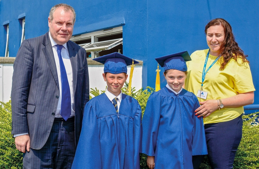 Conor pictured with two Manorside students. 