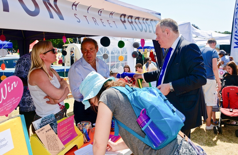 Conor talking with a community research project team at Winton carnival.