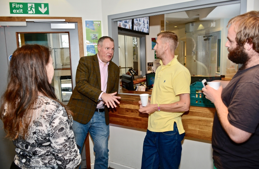 Conor talking with residents at the YMCA.  During his visit Conor met with the team as well as engaging with those who were previously homeless.