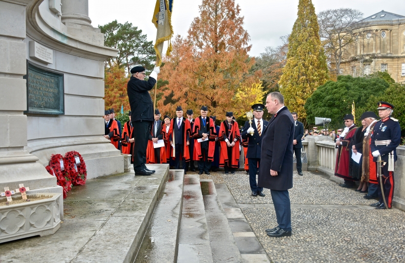 Conor lays a wreath at the war memorial on Remembrance Sunday.