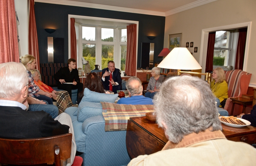 Conor chatting to local residents at a house meeting in Westbourne.