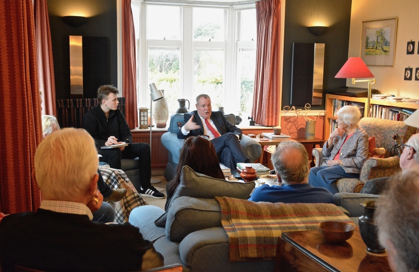 Conor chatting to local residents at a house meeting in Westbourne.