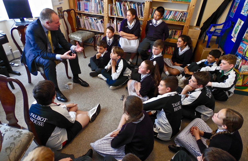 Conor speaking with pupils at Talbot House School.