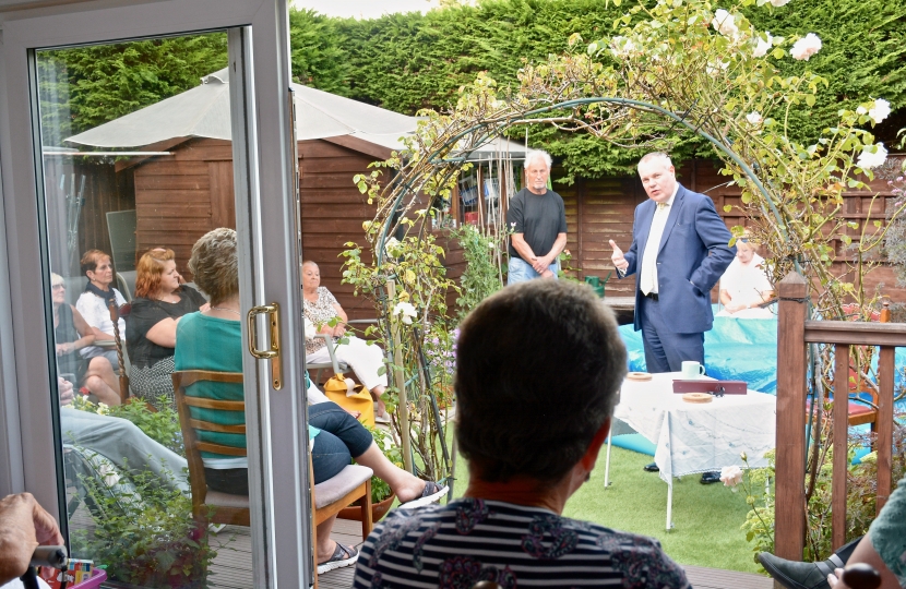 Conor addressing a house meeting in Northbourne.