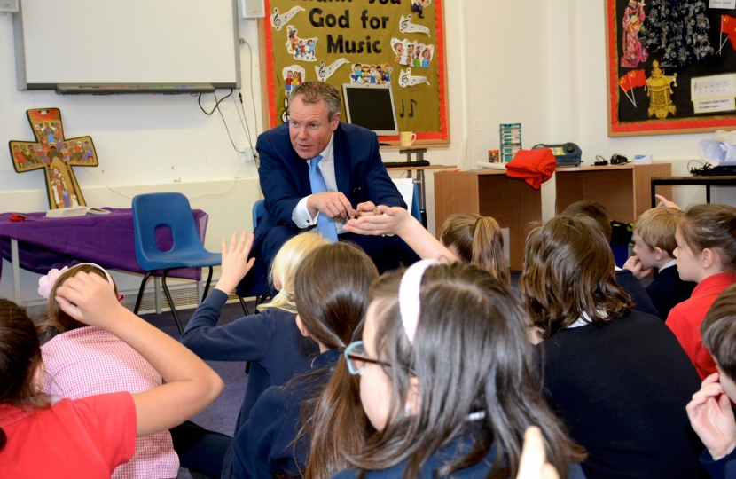 Conor listens to a question from a Christ the King pupil