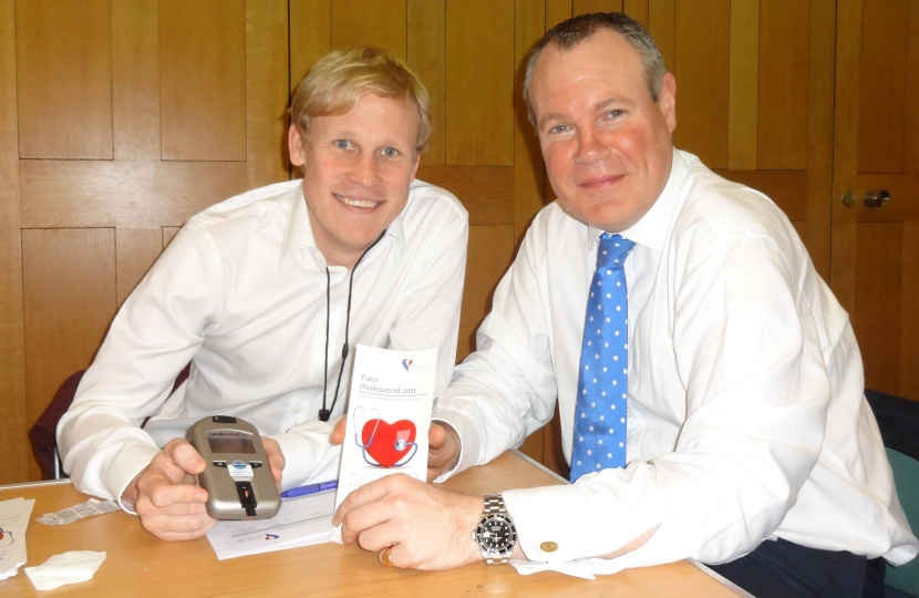 Conor Burns having his cholesterol tested at the Heart UK reception.