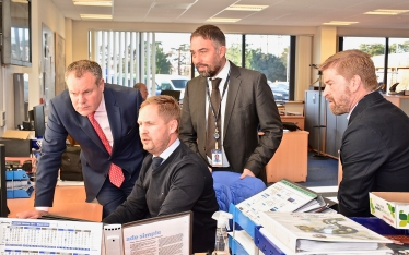 Conor pictured being shown how SGN operates.