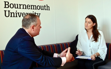 Conor pictured answering questions on intimidation at Conservative Party Conference from BU events student, Hannah Hansard. 