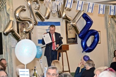 Conor pictured presenting letter to the Bournemouth Hebrew Congregation from the Prime Minister.