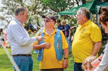 Conor pictured talking with members of the Westbourne Rotary Club on the Savoy Hotel grounds. 