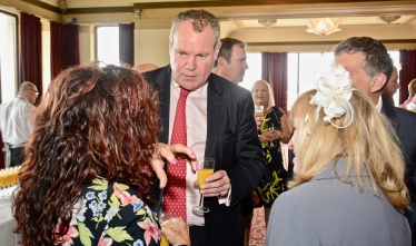 Conor pictured discussing local events with attendees of the ceremony. 