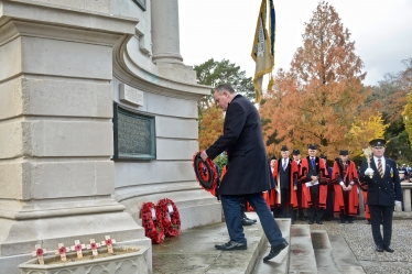 Conor lays a wreath at the war memorial on Remembrance Sunday.