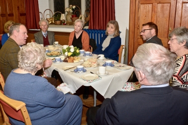 Conor enjoys a traditional afternoon tea with the Revd Michael Smith and members of the Parish Church Council.