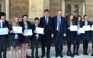 Pupils are presented with their certificates by Conor and the Secretary of State.