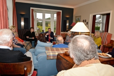 Conor chatting to local residents at a house meeting in Westbourne.