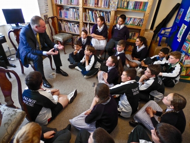 Conor speaking with pupils at Talbot House School.